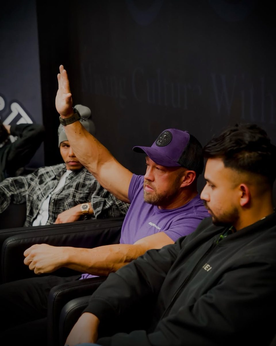 Greg Kimble raising his hand during the panel