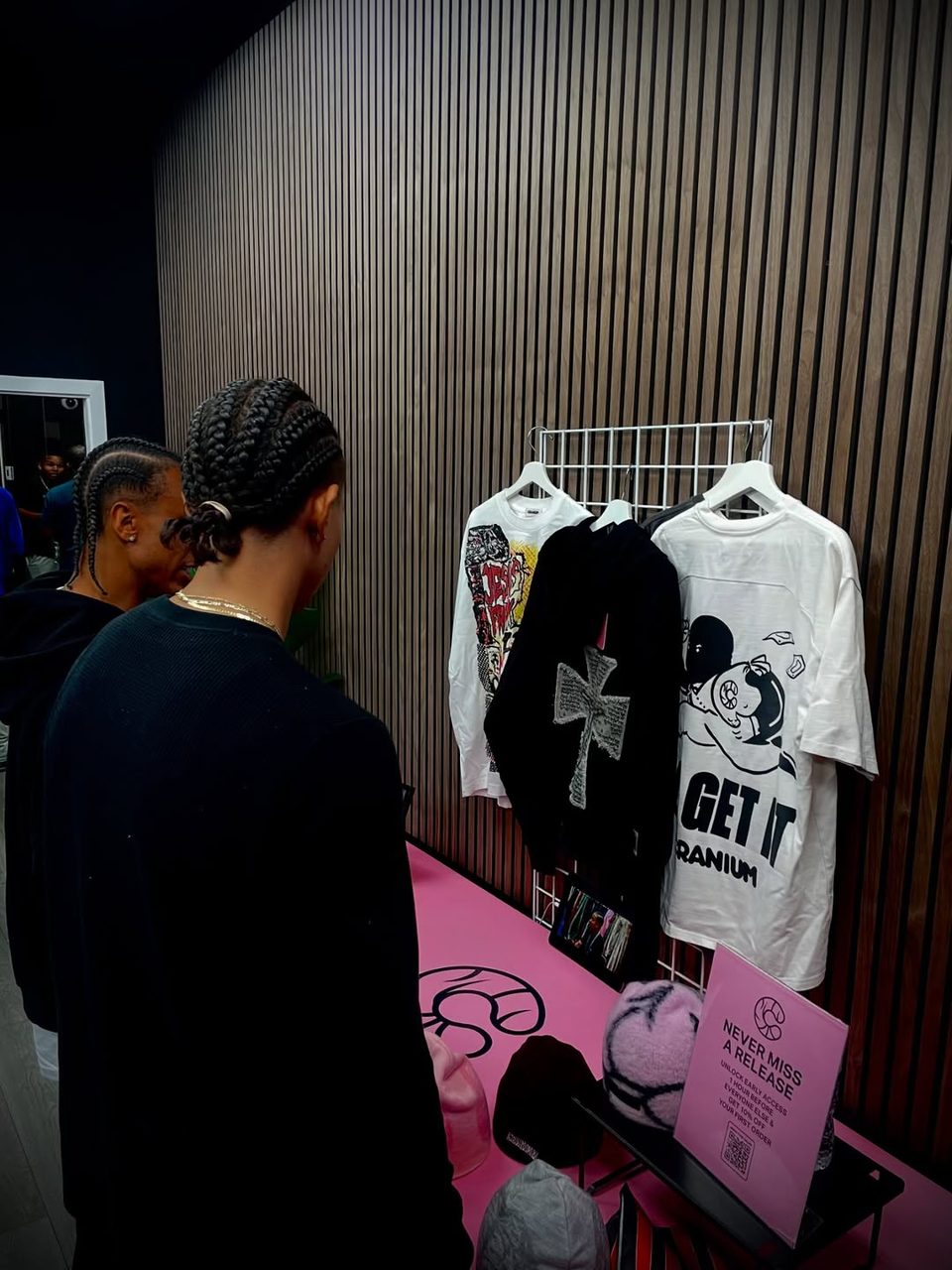 A guest browsing the merch table