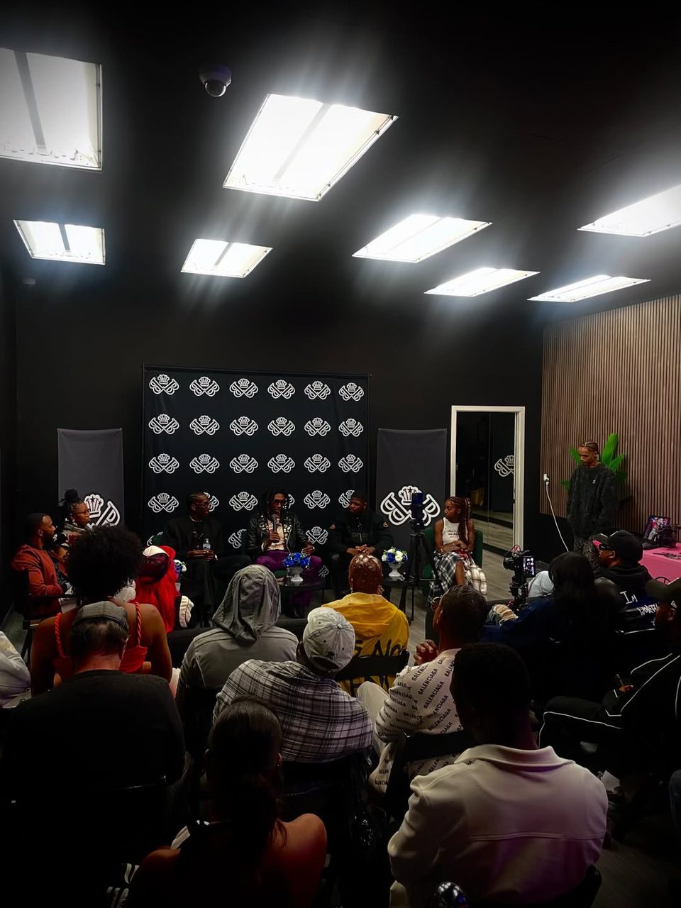 Panelists talking with guests
