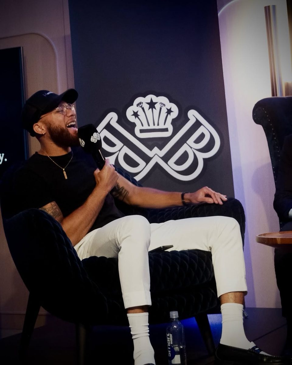 A panelist laughing on stage