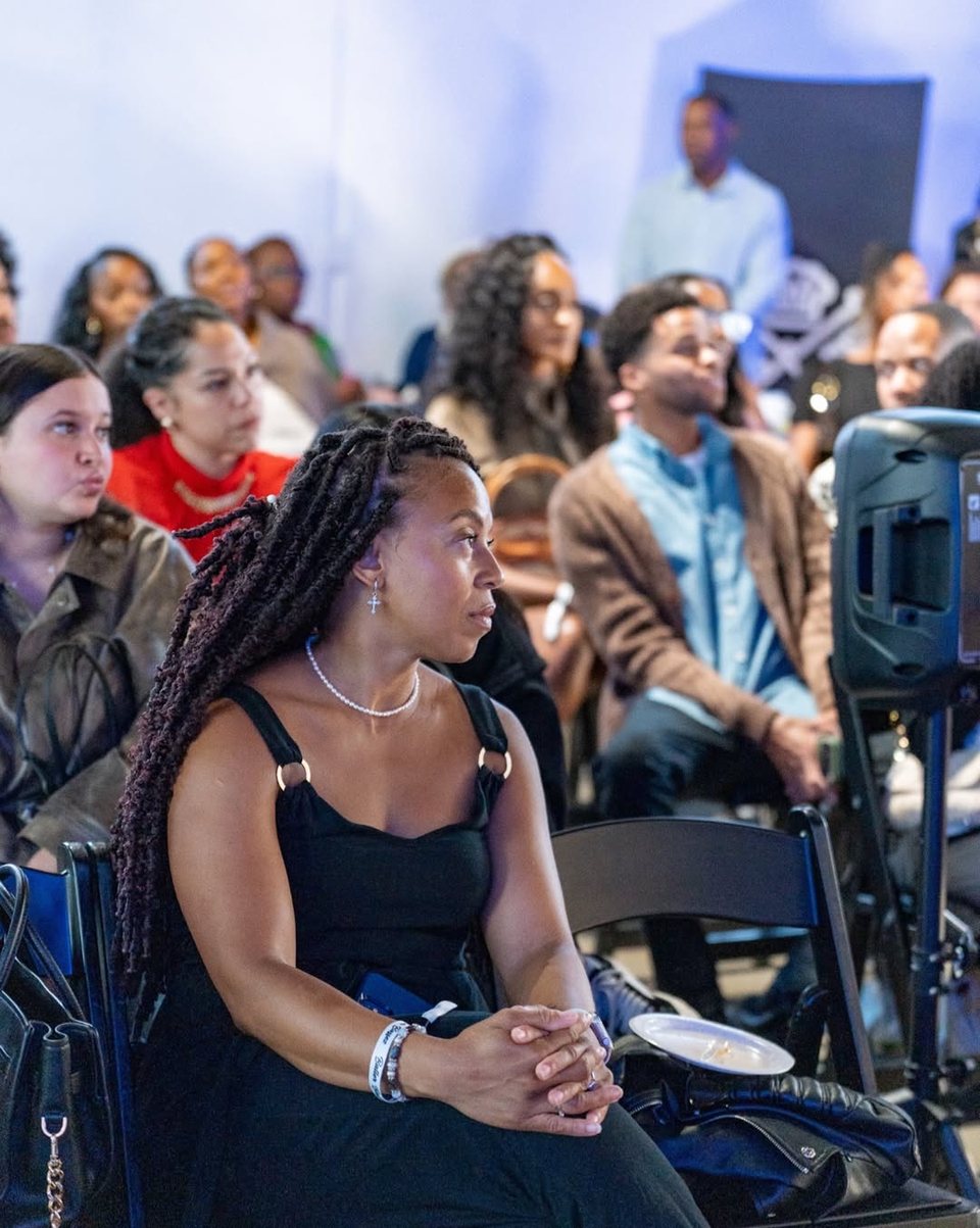A guest listening during the panel