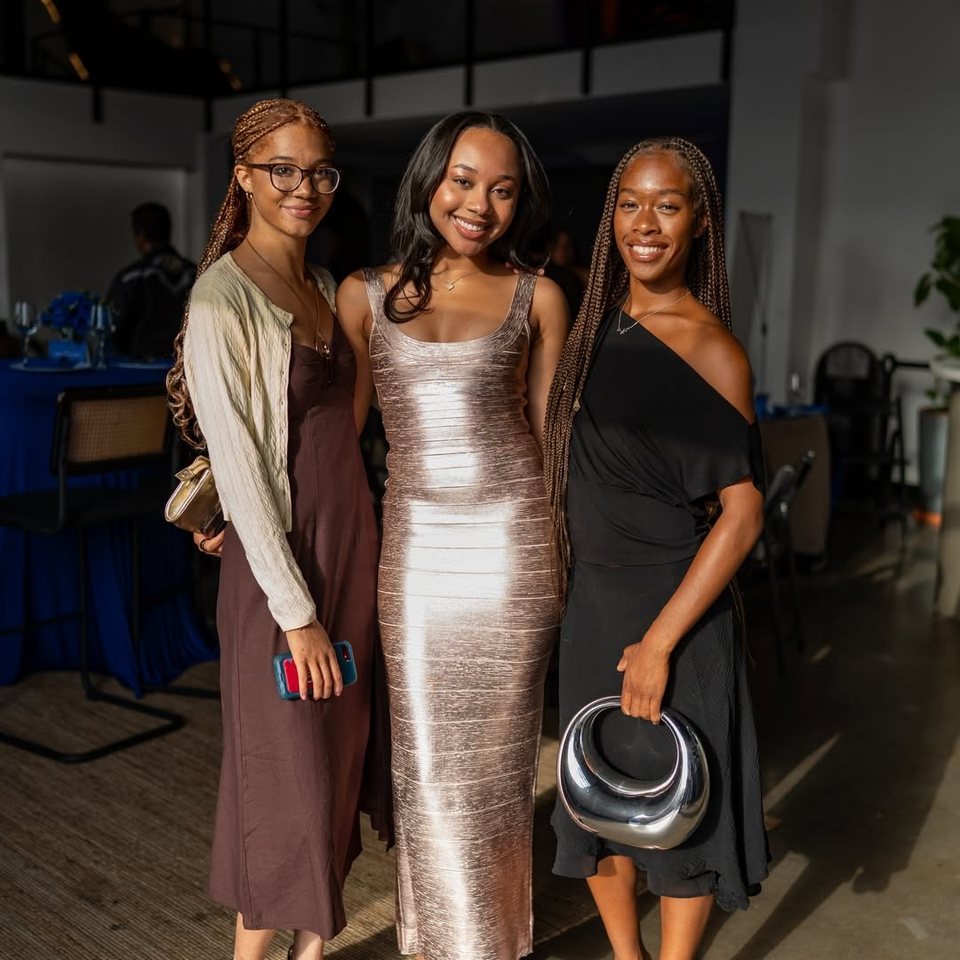 Three guests posing together